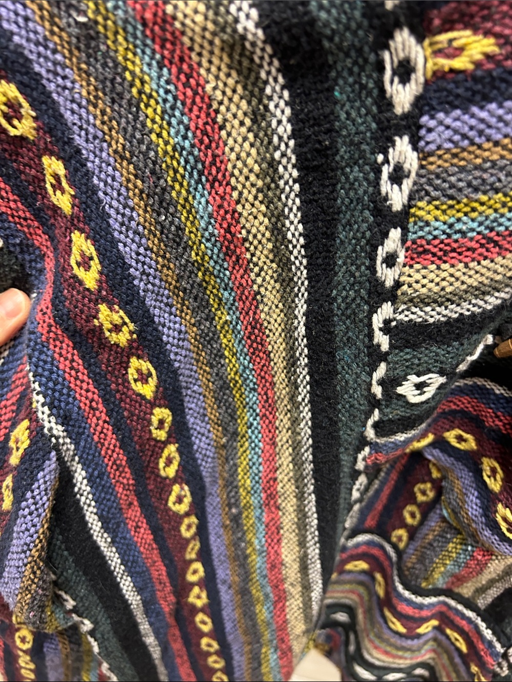 a colorful woven Baja hoodie featuring a striped pattern and a front pocket image 2